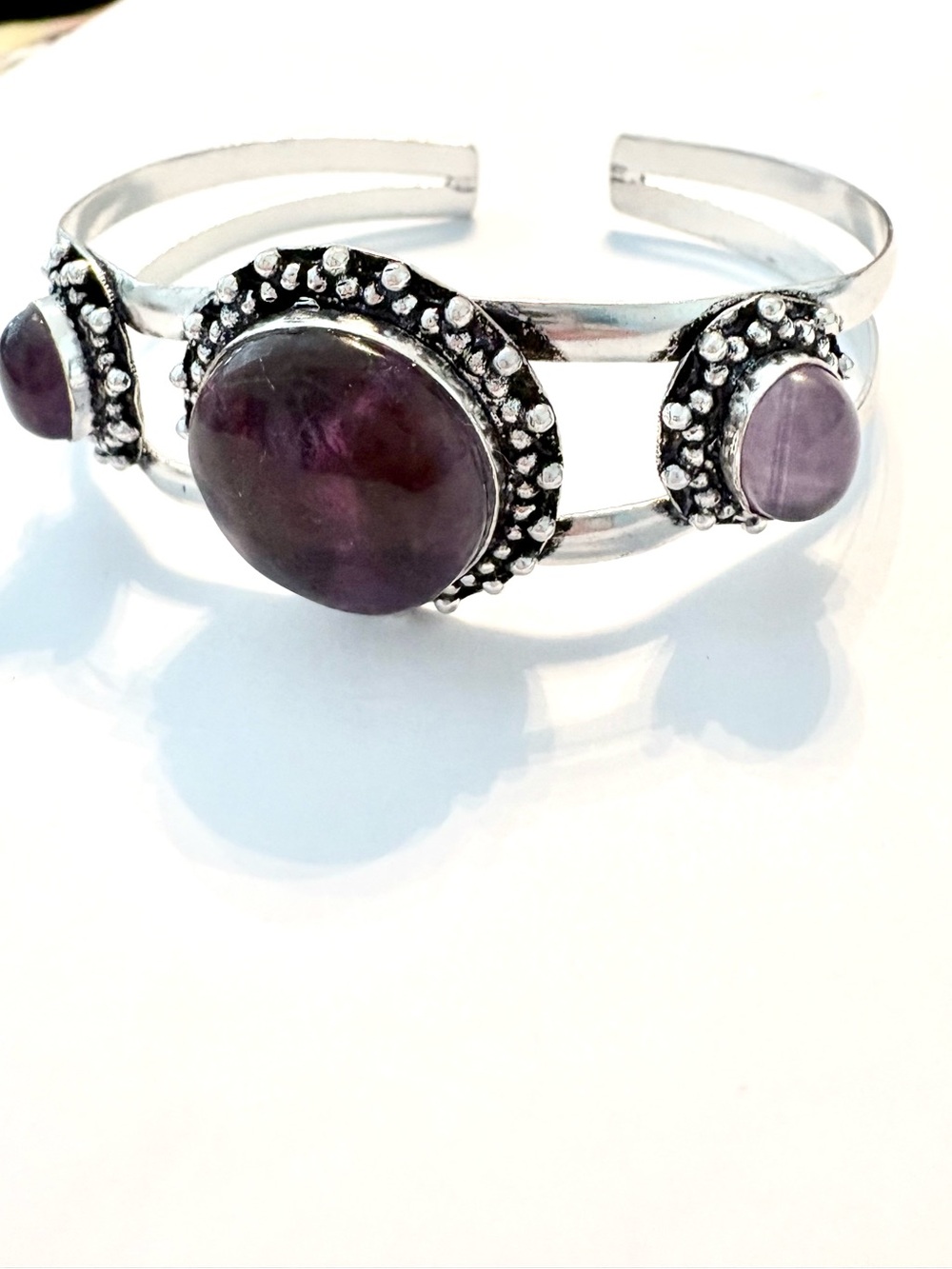 925 marked, 3 stone, purple Amethyst cuff bracelet,  adjustable, 8 inch around.